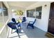 Screened patio with seating for four and view of tropical landscaping at 2348 Shelley St # 8, Clearwater, FL 33765