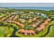 Scenic aerial view of a waterfront community featuring lush landscaping, serene ponds, and beautiful residences at 2400 Feather Sound Dr # 1118, Clearwater, FL 33762