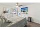 Cozy bedroom with a TV, ceiling fan and a window view at 2400 Feather Sound Dr # 1118, Clearwater, FL 33762