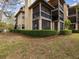 Charming condominium building featuring screened in porch and lush landscaping at 2400 Feather Sound Dr # 1118, Clearwater, FL 33762