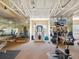 Well-lit gym featuring mirrored walls, fitness equipment, and ample space for various workout activities at 2400 Feather Sound Dr # 1118, Clearwater, FL 33762