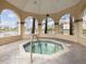 Relaxing hot tub enclosed within a gazebo, offering a serene escape with views of the surrounding landscape at 2400 Feather Sound Dr # 1118, Clearwater, FL 33762