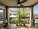 Relaxing screened-in lanai with lake views and plenty of plants at 2400 Feather Sound Dr # 1118, Clearwater, FL 33762