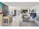 Open-concept living area with tile flooring, modern lighting, and combined living and dining spaces at 2400 Feather Sound Dr # 1118, Clearwater, FL 33762