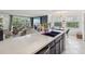 Well-lit open floorplan showcasing the kitchen, living and dining area at 2400 Feather Sound Dr # 1118, Clearwater, FL 33762