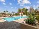Inviting swimming pool surrounded by lounge chairs, lush greenery, and a gazebo, ideal for summer enjoyment at 2400 Feather Sound Dr # 1118, Clearwater, FL 33762
