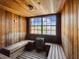 Inviting wood-paneled sauna with benches and a window for relaxing at 2400 Feather Sound Dr # 1118, Clearwater, FL 33762