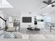 Tastefully decorated living room with updated flooring, contemporary furnishings, and an open layout at 2523 Northfield Ln, Clearwater, FL 33761