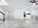 Spacious living area features updated tile floors, modern finishes, and an open floor plan at 2523 Northfield Ln, Clearwater, FL 33761