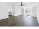 Bright main bedroom featuring a ceiling fan, wood floors, vanity area, and lots of space at 2523 Northfield Ln, Clearwater, FL 33761