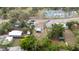 Aerial view of neighborhood, featuring tennis courts and metal carport at 2610 E Yukon St, Tampa, FL 33604