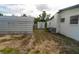 Exterior side view of the home, metal storage unit and shed in the backyard at 2610 E Yukon St, Tampa, FL 33604