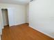 Bedroom featuring wood-look flooring and a spacious closet at 2610 E Yukon St, Tampa, FL 33604