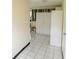 Bedroom featuring tiled floor and storage cabinets at 2610 E Yukon St, Tampa, FL 33604