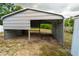 Close up view of the metal frame carport in the backyard of property at 2610 E Yukon St, Tampa, FL 33604