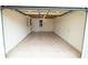 Spacious garage featuring tiled flooring and paneled walls at 2610 E Yukon St, Tampa, FL 33604