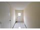 Hallway with tiled floor leading to an exterior door at 2610 E Yukon St, Tampa, FL 33604