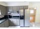 Functional kitchen with modern appliances, ample cabinet space, and easy access to the dining area at 2610 E Yukon St, Tampa, FL 33604