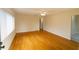 The spacious living room with wood floors and neutral paint offers a bright atmosphere at 2610 E Yukon St, Tampa, FL 33604