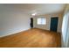Open living room features wood floors, ceiling fan, and natural light at 2610 E Yukon St, Tampa, FL 33604