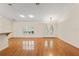 Bright living room with hardwood floors, double front doors, and natural light at 26290 Hayman Rd, Brooksville, FL 34602