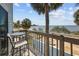 Relaxing balcony view with beach, trees, and ocean views at 3457 Cyclone Dr, Weeki Wachee, FL 34607