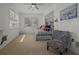 Versatile room with daybed, artwork, and windows offering natural light, creating a welcoming space at 3457 Cyclone Dr, Weeki Wachee, FL 34607