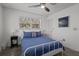 Cozy bedroom features white walls, plush carpet, and a comfortable bed under a modern ceiling fan at 3457 Cyclone Dr, Weeki Wachee, FL 34607