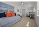 Bright bonus room with flexible layout, offering a cozy daybed and functional desk space at 3457 Cyclone Dr, Weeki Wachee, FL 34607