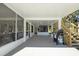 Spacious covered patio with screened area and stairs at 3457 Cyclone Dr, Weeki Wachee, FL 34607