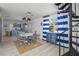 Open concept dining area with spiral staircase and modern furnishings at 3457 Cyclone Dr, Weeki Wachee, FL 34607