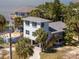 Exterior elevation of home with driveway and lush landscaping at 3457 Cyclone Dr, Weeki Wachee, FL 34607
