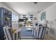 Bright living room with nautical decor, comfortable seating, and ocean view from balcony at 3457 Cyclone Dr, Weeki Wachee, FL 34607
