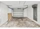 Spacious unfinished basement with a garage door offers versatile storage or potential for customization at 3646 Springfield Dr, Holiday, FL 34691