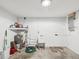 Utility basement featuring a utility sink, water heater, and painted walls, providing practical space at 3646 Springfield Dr, Holiday, FL 34691