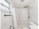 Bathroom featuring a marble-look shower, rainfall showerhead, and modern vanity at 3646 Springfield Dr, Holiday, FL 34691