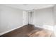 This bedroom has a closet and wood-look tile floors at 3646 Springfield Dr, Holiday, FL 34691