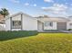 Charming home with a well-maintained front lawn, features a cozy exterior and an attached garage at 3646 Springfield Dr, Holiday, FL 34691