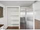 Kitchen featuring stainless steel refrigerator and pantry at 3646 Springfield Dr, Holiday, FL 34691