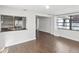 Living room featuring an open view to the kitchen and a window with natural light at 3646 Springfield Dr, Holiday, FL 34691