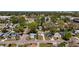 Wide aerial shot of homes in a densely wooded neighborhood on a clear day at 3755 10Th S Ave, St Petersburg, FL 33711
