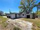 Backyard featuring a storage shed, lawn and large driveway at 3755 10Th S Ave, St Petersburg, FL 33711