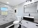 Modern bathroom showcasing a tiled shower, black fixtures, and a sleek vanity at 3755 10Th S Ave, St Petersburg, FL 33711