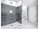 Elegant bathroom featuring a tiled shower, modern fixtures, and stylish marble flooring at 3755 10Th S Ave, St Petersburg, FL 33711