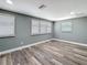 Bright bedroom featuring hardwood flooring, fresh paint and multiple windows at 3755 10Th S Ave, St Petersburg, FL 33711