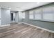 Neutral bedroom showcases hardwood floors and natural light from the windows at 3755 10Th S Ave, St Petersburg, FL 33711