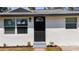 Close up of the freshy painted entrance to the single-story home at 3755 10Th S Ave, St Petersburg, FL 33711