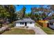 Aerial view of a renovated single-Gathering home, showcasing its well-maintained exterior and landscaped yard at 3755 10Th S Ave, St Petersburg, FL 33711