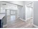 Spacious hallway with laminate wood flooring, connecting the living spaces with an abundance of natural light at 3755 10Th S Ave, St Petersburg, FL 33711