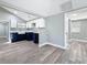Kitchen and living room, with bright spaces and vinyl floors, creating an open floor plan at 3755 10Th S Ave, St Petersburg, FL 33711